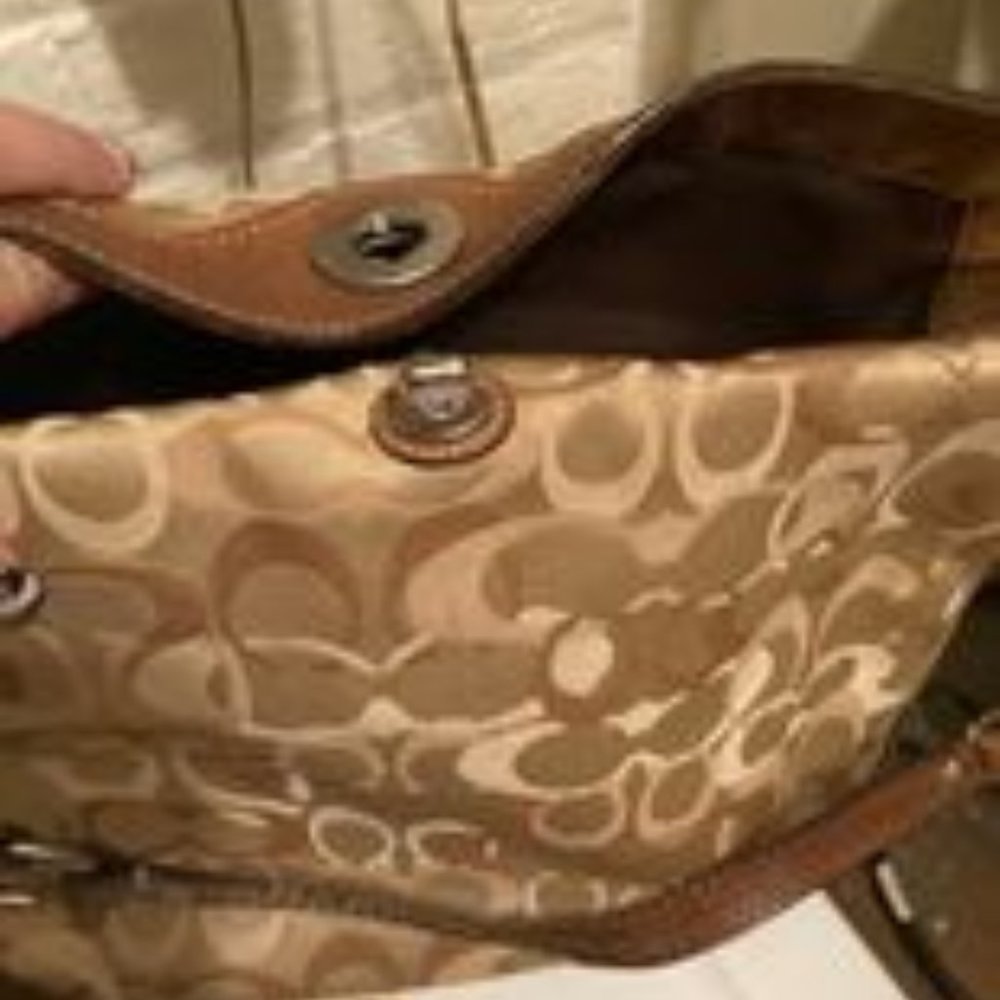 used coach pursewith turn lock closure